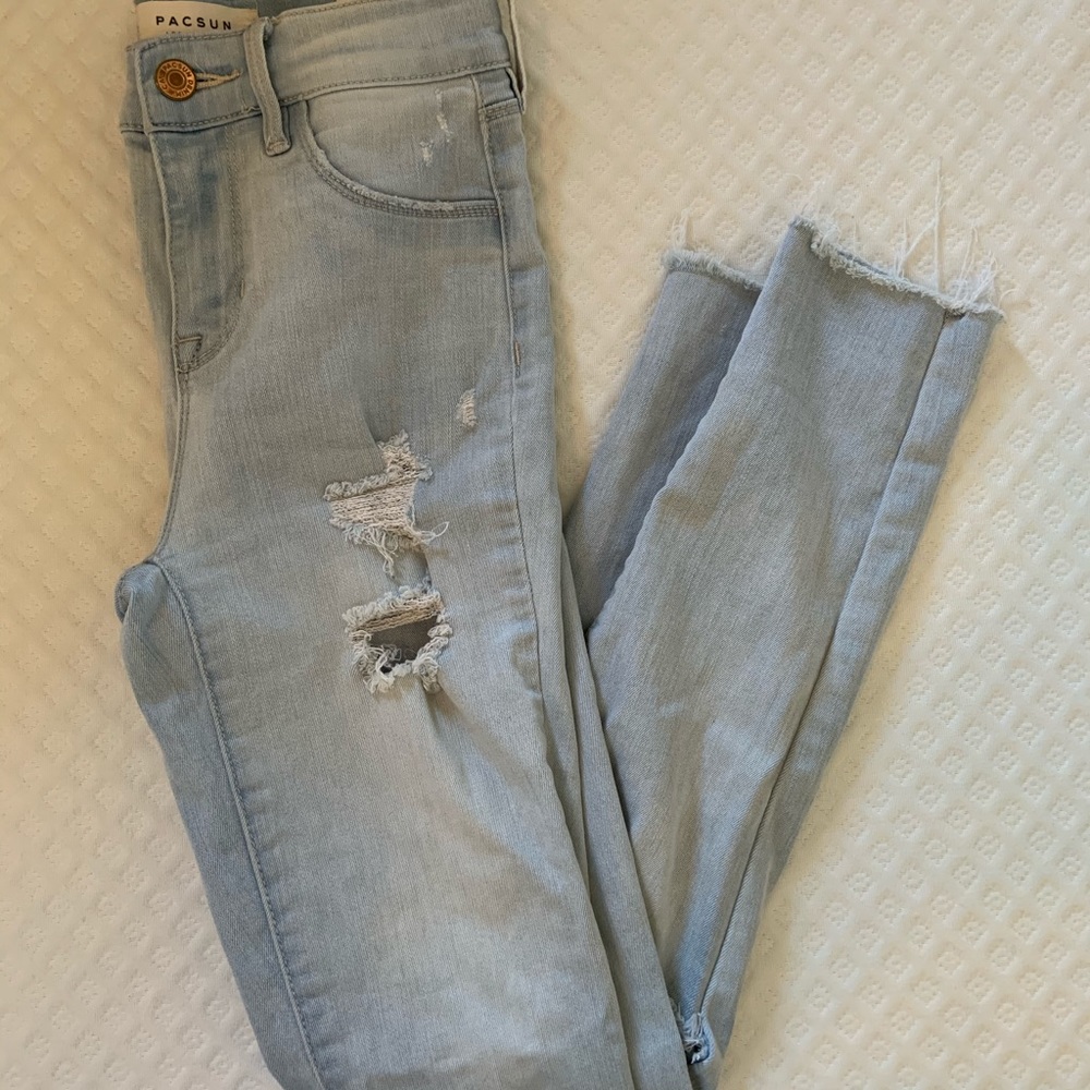 Light wash distressed skinny jeans